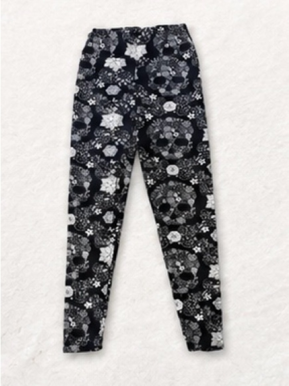 Two pairs of Kids Black leggings one Floral Skull Print Leggings and Zebra size